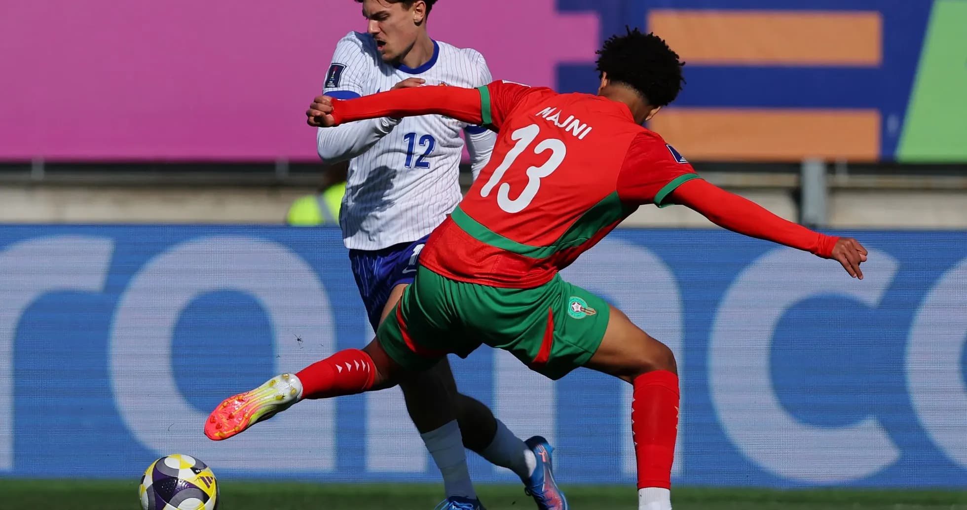 Player tackling opponent during football match action Player tackling opponent during football match action