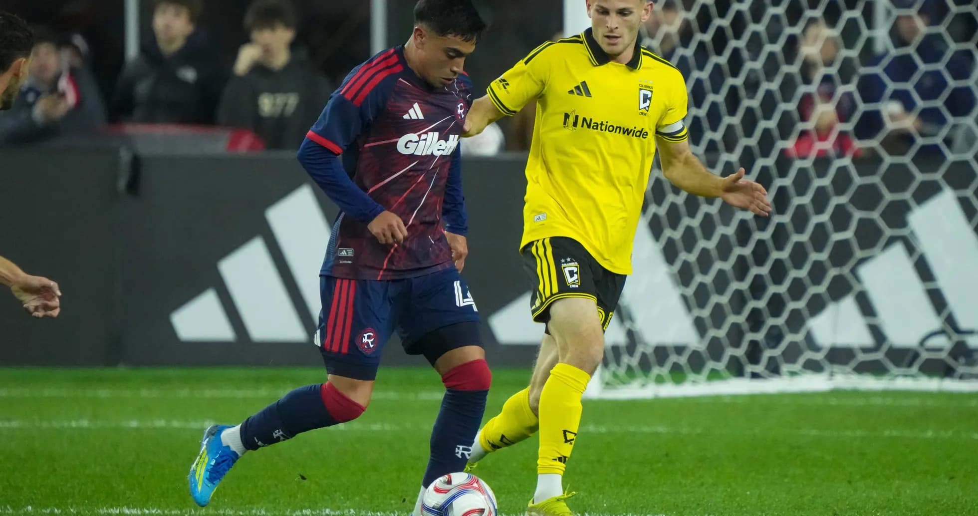 Players competing for the ball in MLS match Players competing for the ball in MLS match