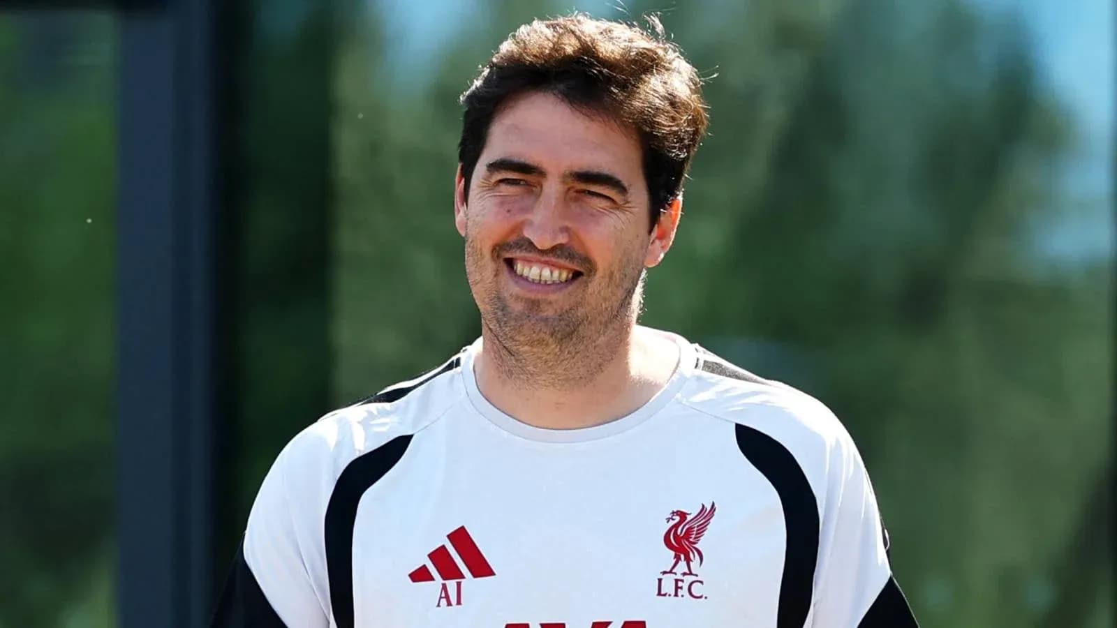 Coach smiling during Liverpool training session Coach smiling during Liverpool training session
