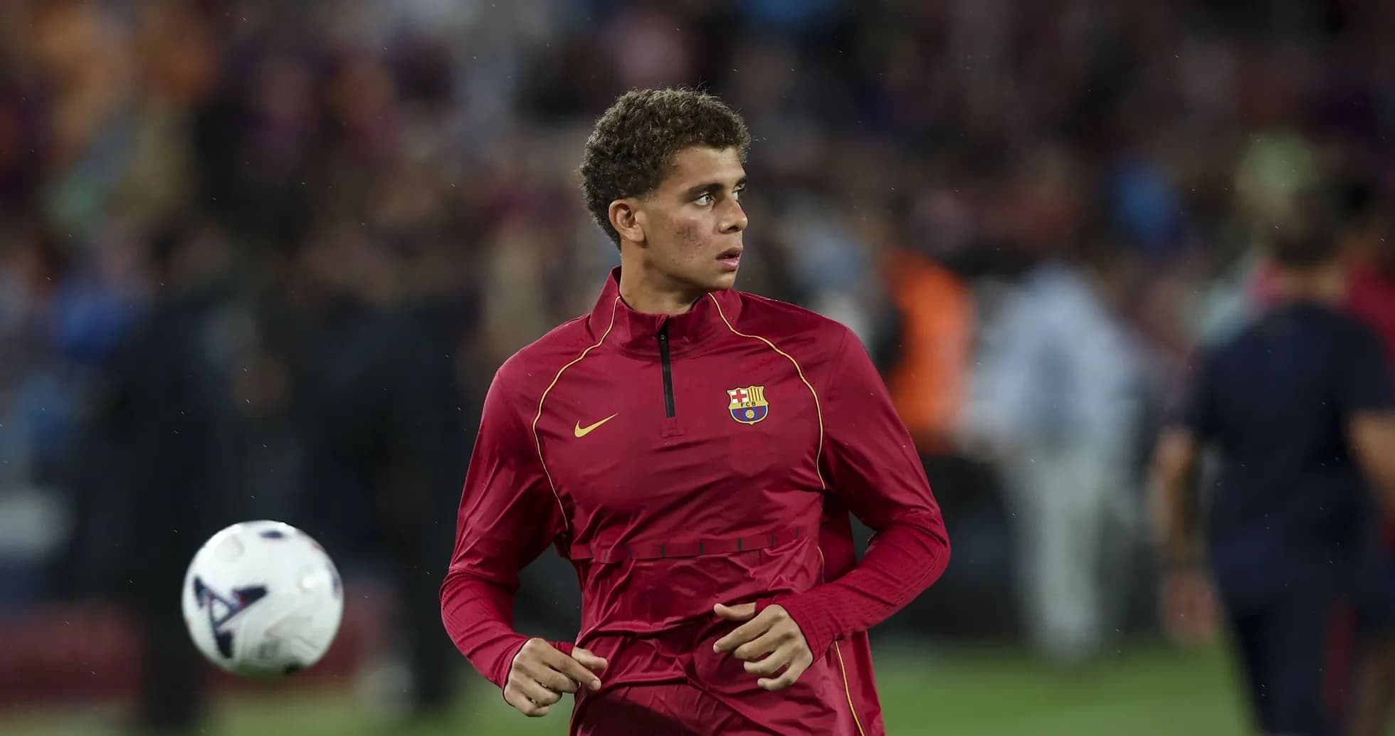 Player warming up in FC Barcelona training kit Player warming up in FC Barcelona training kit