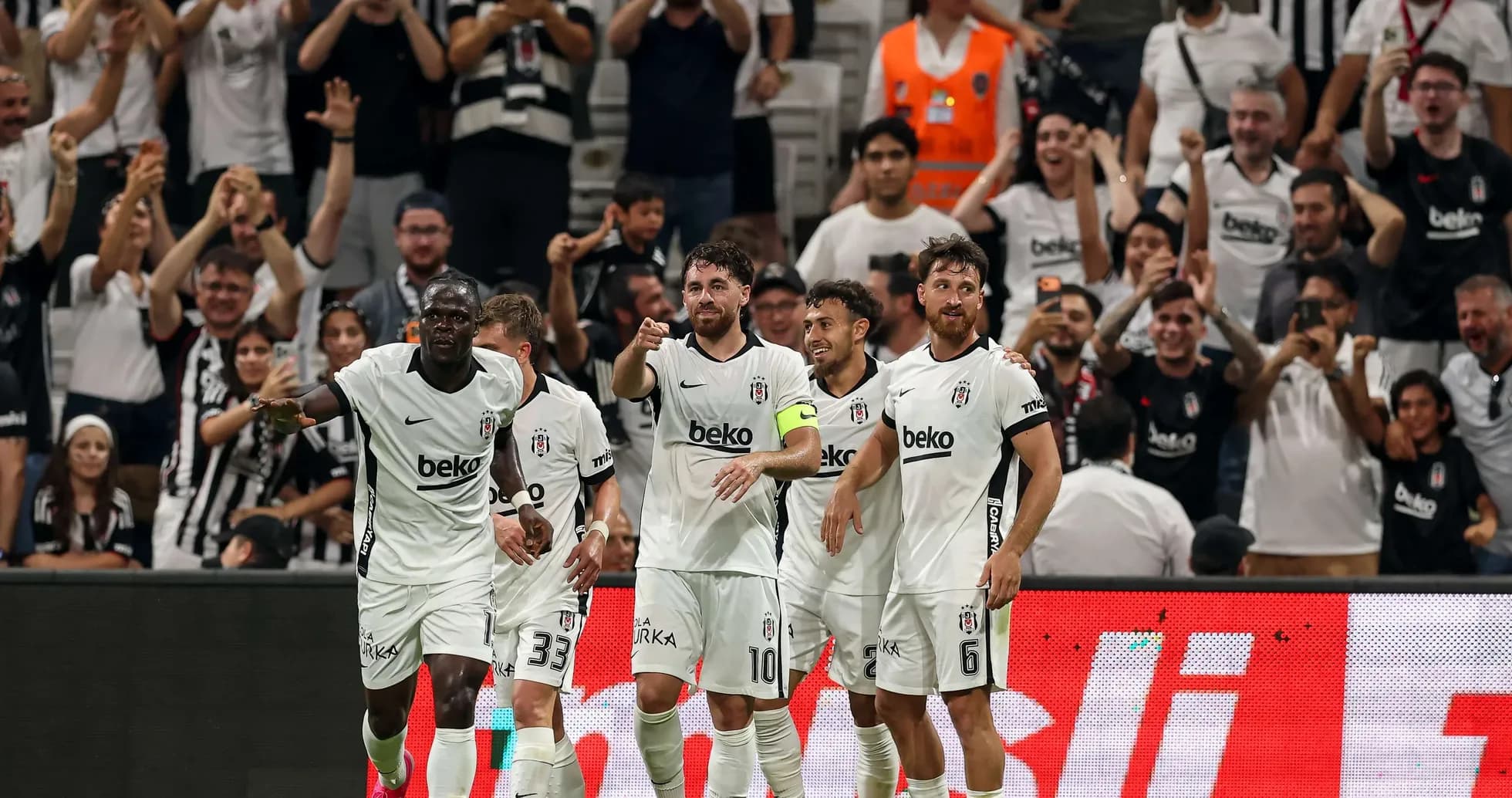 Beşiktaş players celebrating a goal with fans Beşiktaş players celebrating a goal with fans