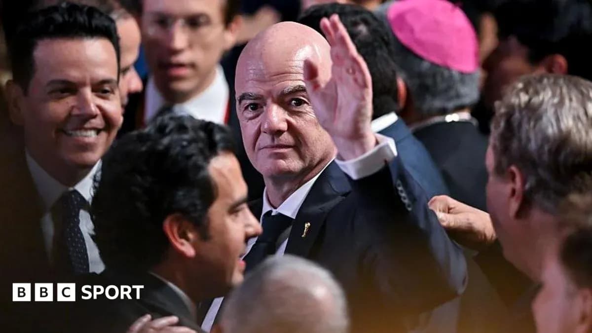 Gianni Infantino waving at an event gathering Gianni Infantino waving at an event gathering