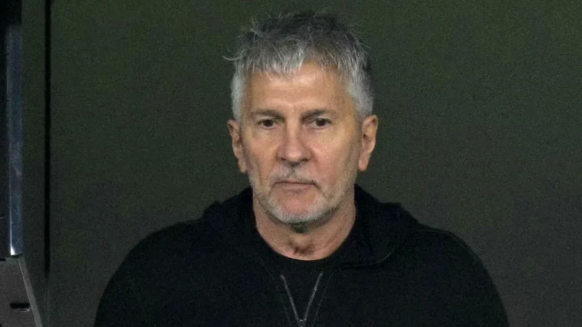 Man in a black hoodie looking directly at camera Man in a black hoodie looking directly at camera