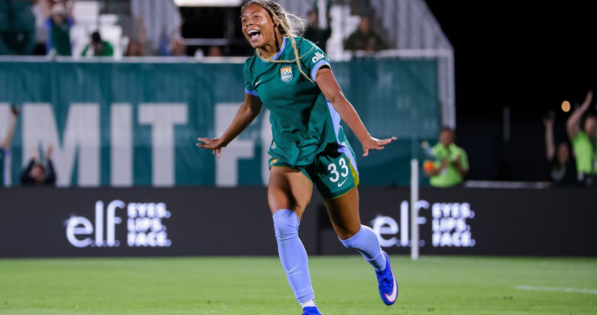 Player celebrating a goal during a soccer match Player celebrating a goal during a soccer match