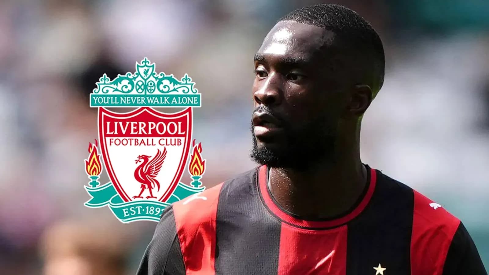 Player in red and black kit with Liverpool logo Player in red and black kit with Liverpool logo