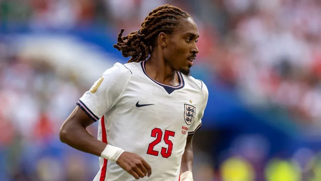 Player in England jersey running during match Player in England jersey running during match
