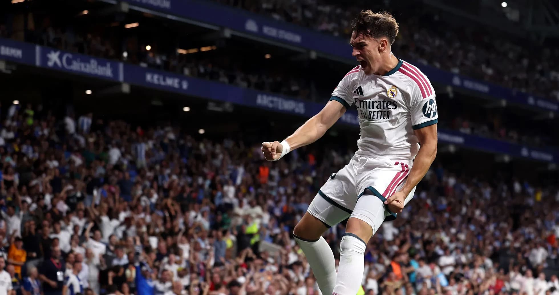 Player celebrating a goal in front of fans Player celebrating a goal in front of fans