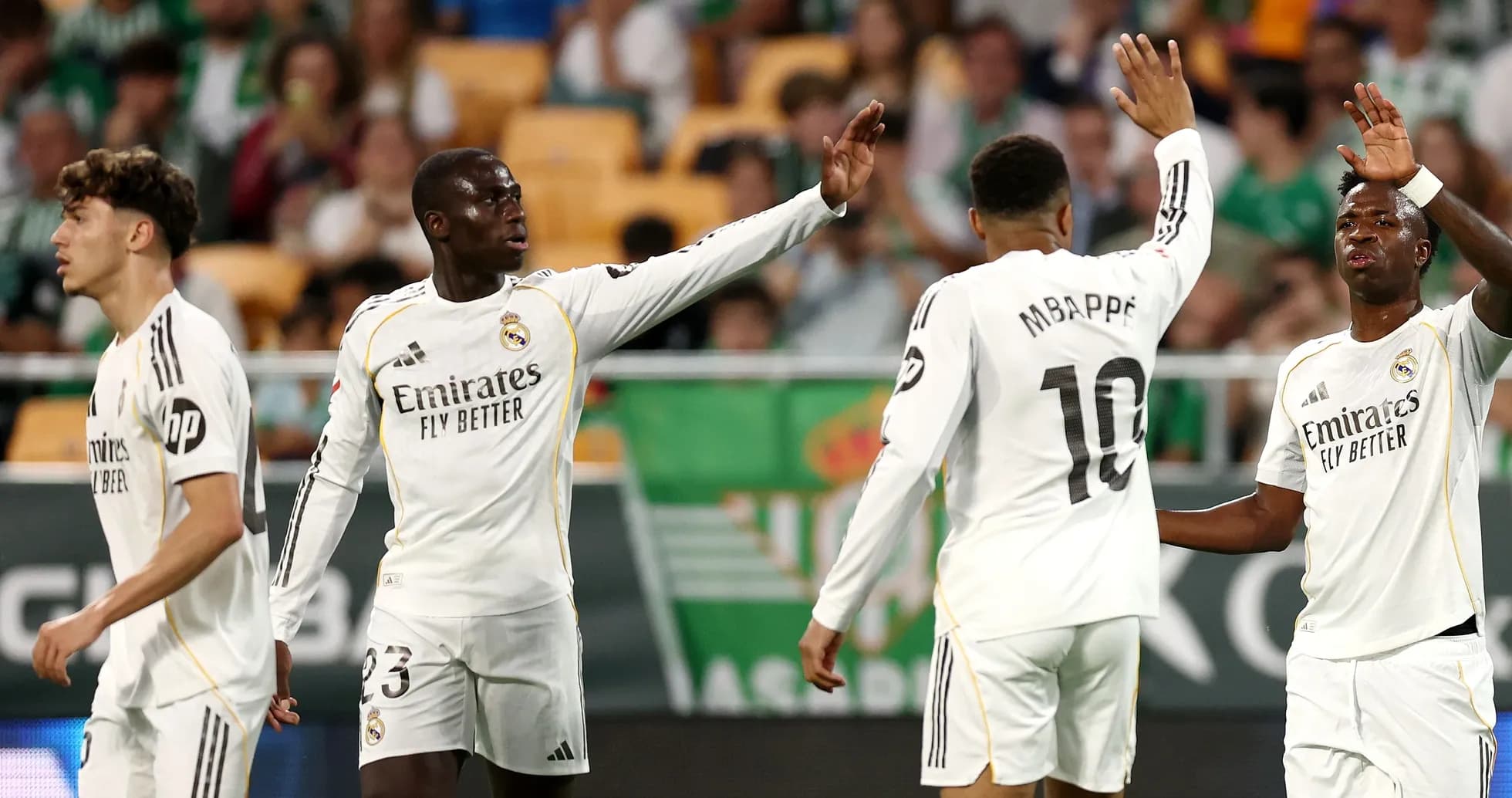 Real Madrid players celebrating during a match Real Madrid players celebrating during a match