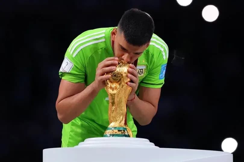 Goalkeeper kissing FIFA World Cup trophy Goalkeeper kissing FIFA World Cup trophy