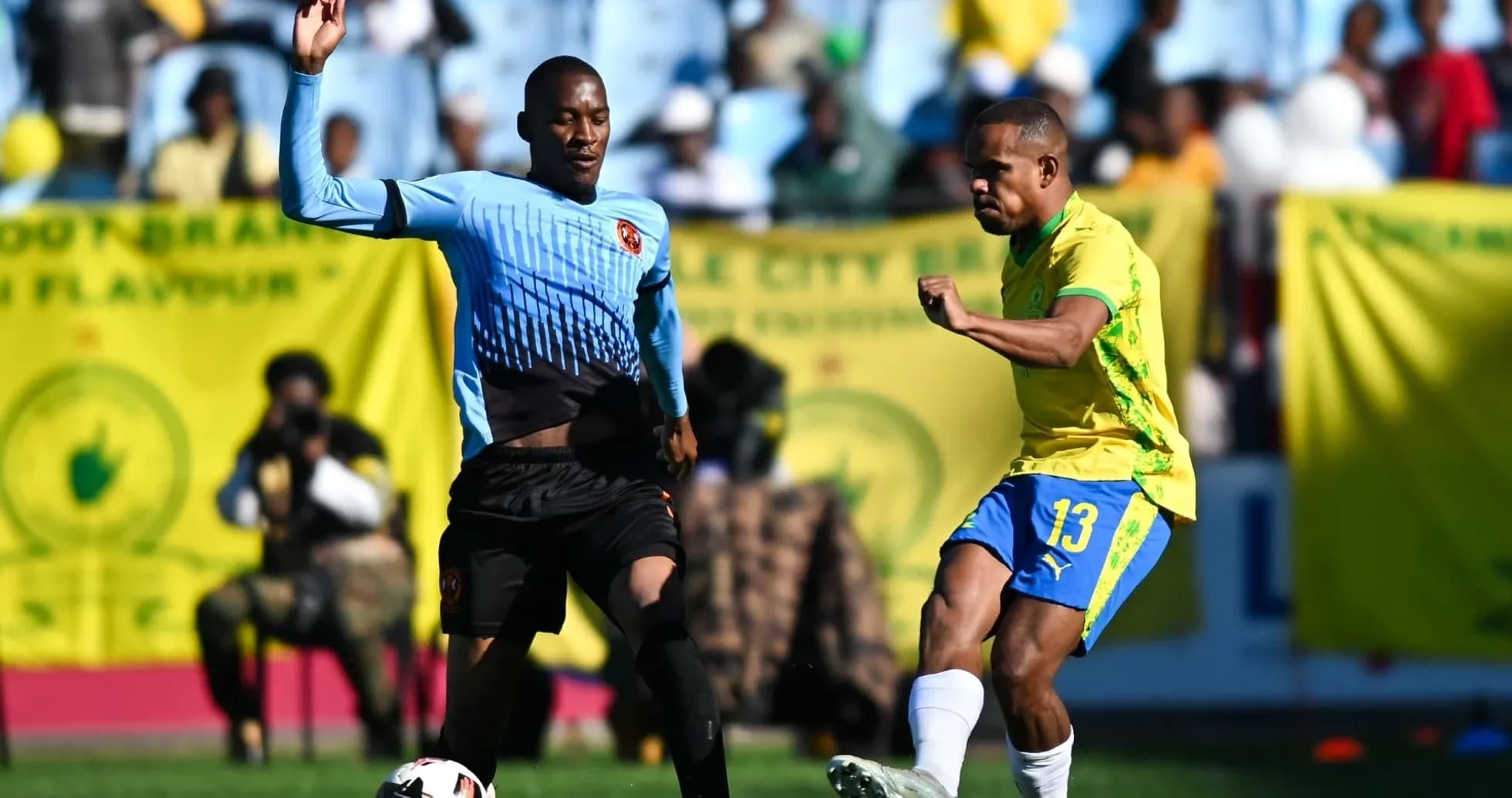 Player kicking the ball during a football match Player kicking the ball during a football match