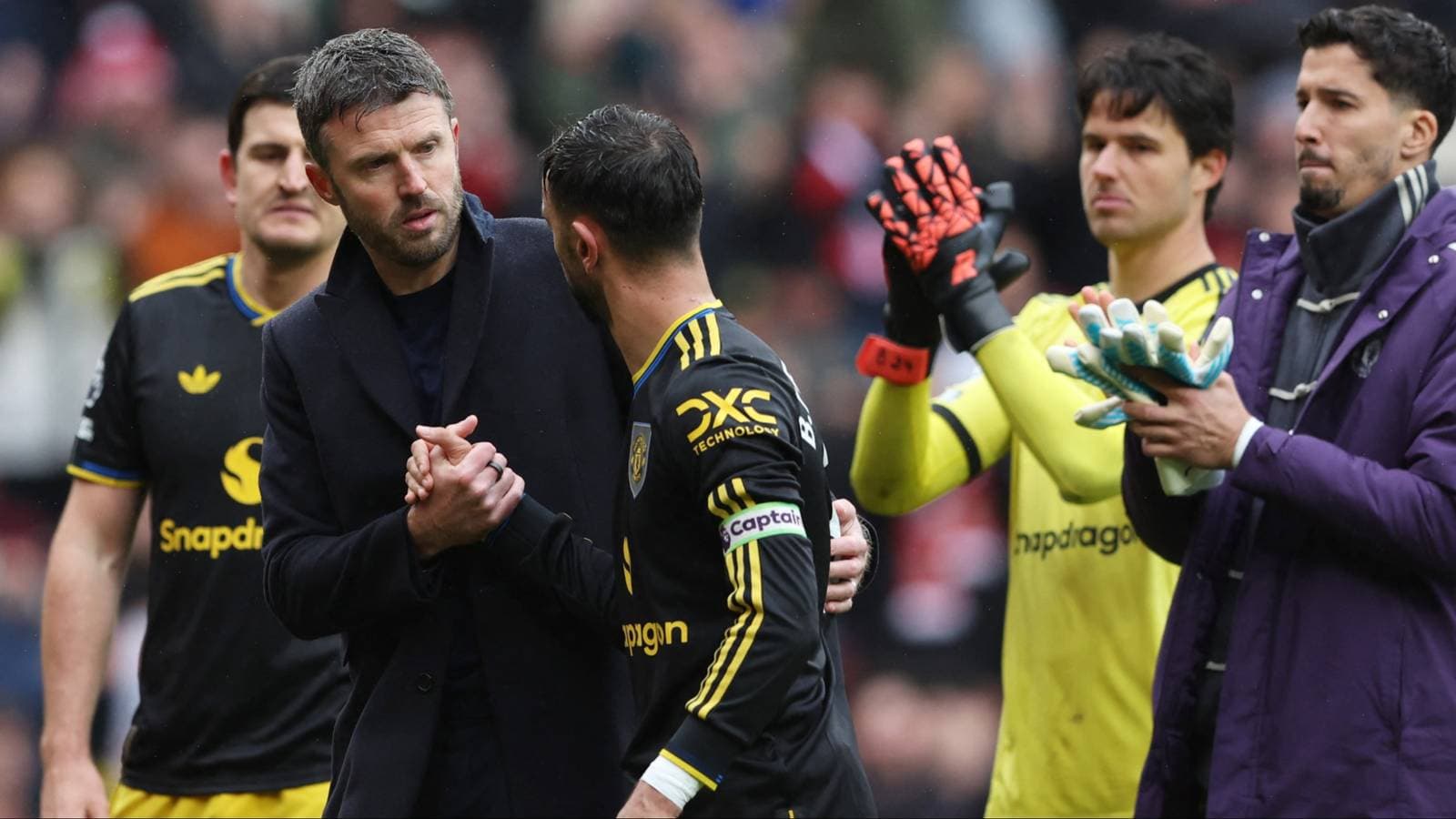 Manager shaking hands with player during substitution Manager shaking hands with player during substitution
