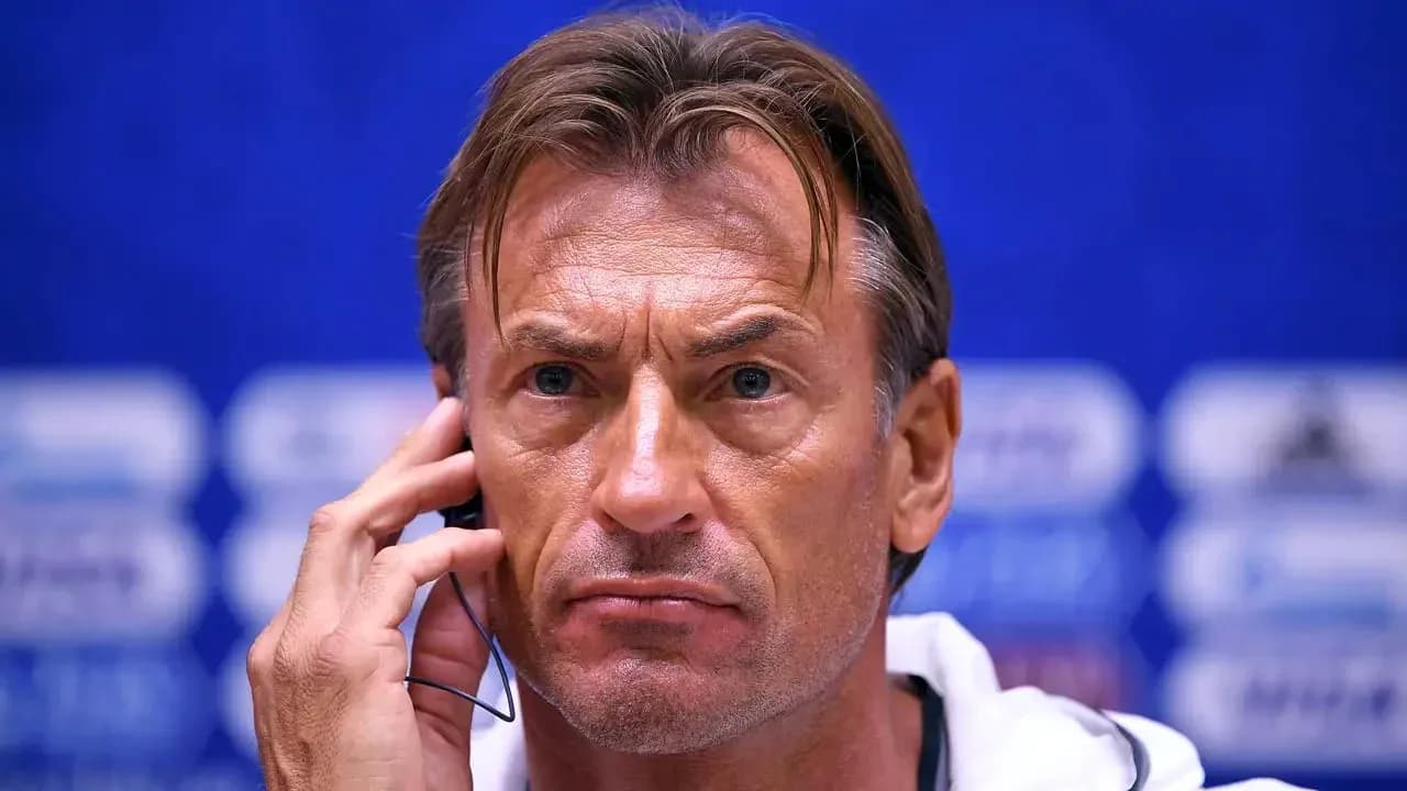 Coach speaking into headset at press conference Coach speaking into headset at press conference