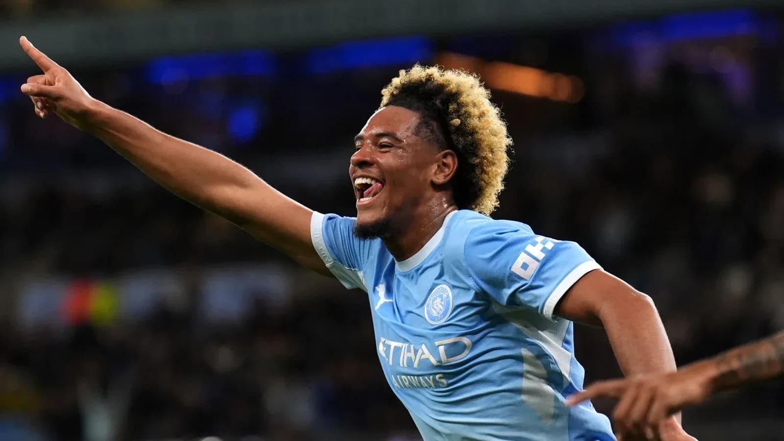 Player celebrating a goal with raised finger Player celebrating a goal with raised finger