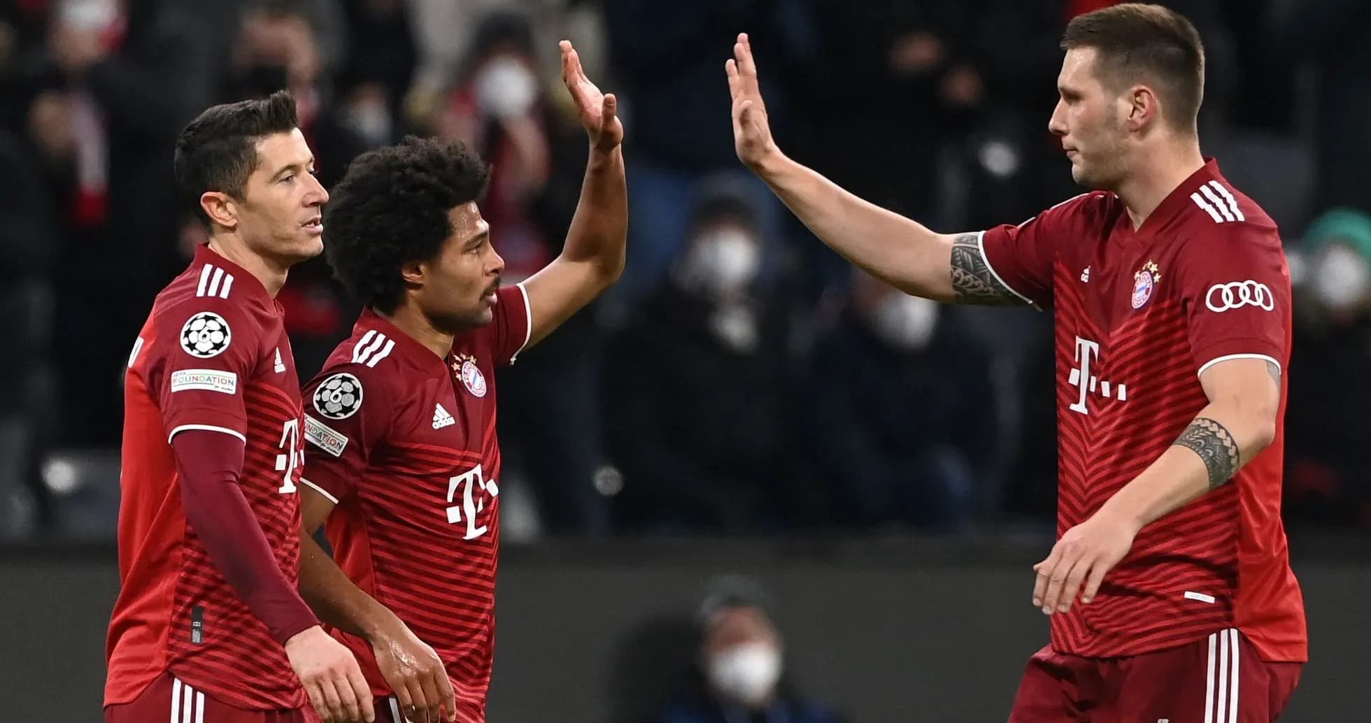 Bayern Munich players celebrating a goal together Bayern Munich players celebrating a goal together