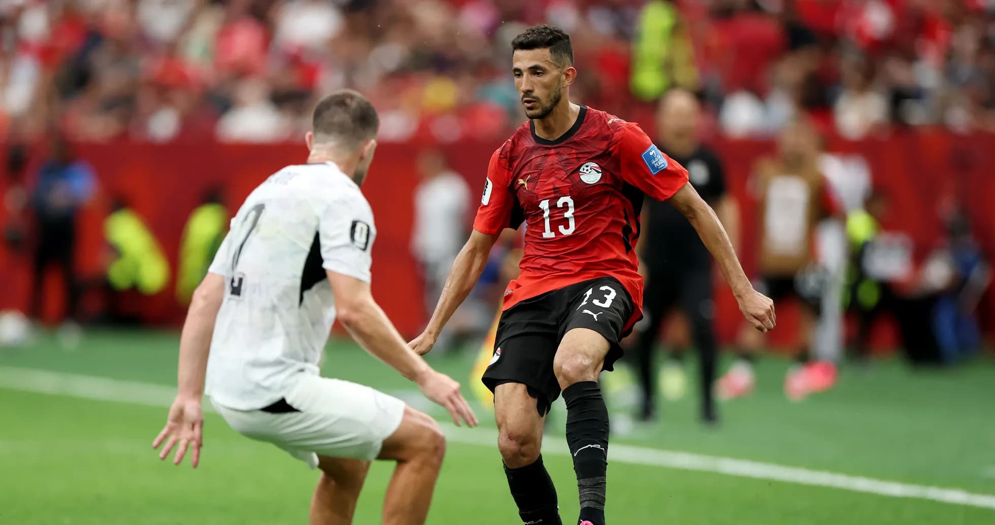 Player dribbling past opponent during match Player dribbling past opponent during match