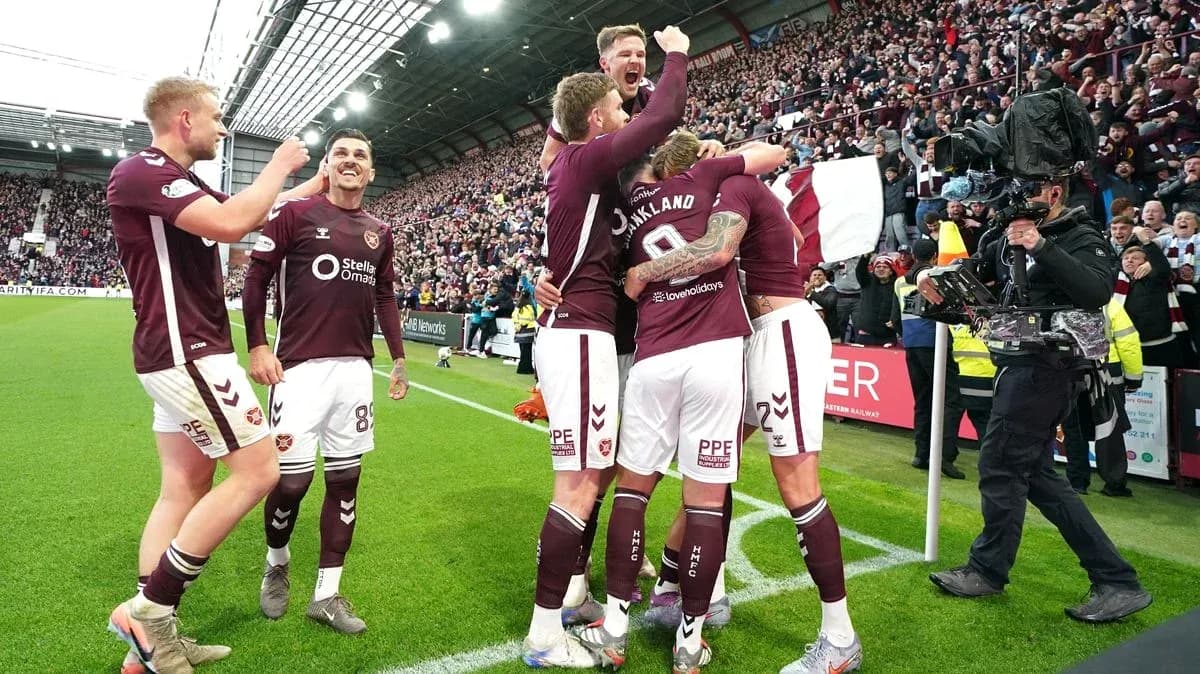 Hearts players celebrating a goal during match Hearts players celebrating a goal during match