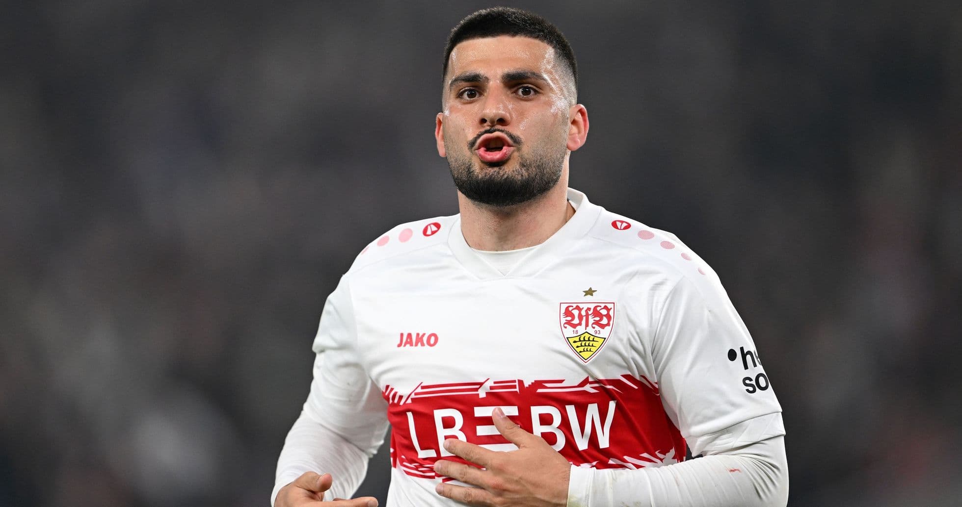 Player gesturing during a football match Player gesturing during a football match