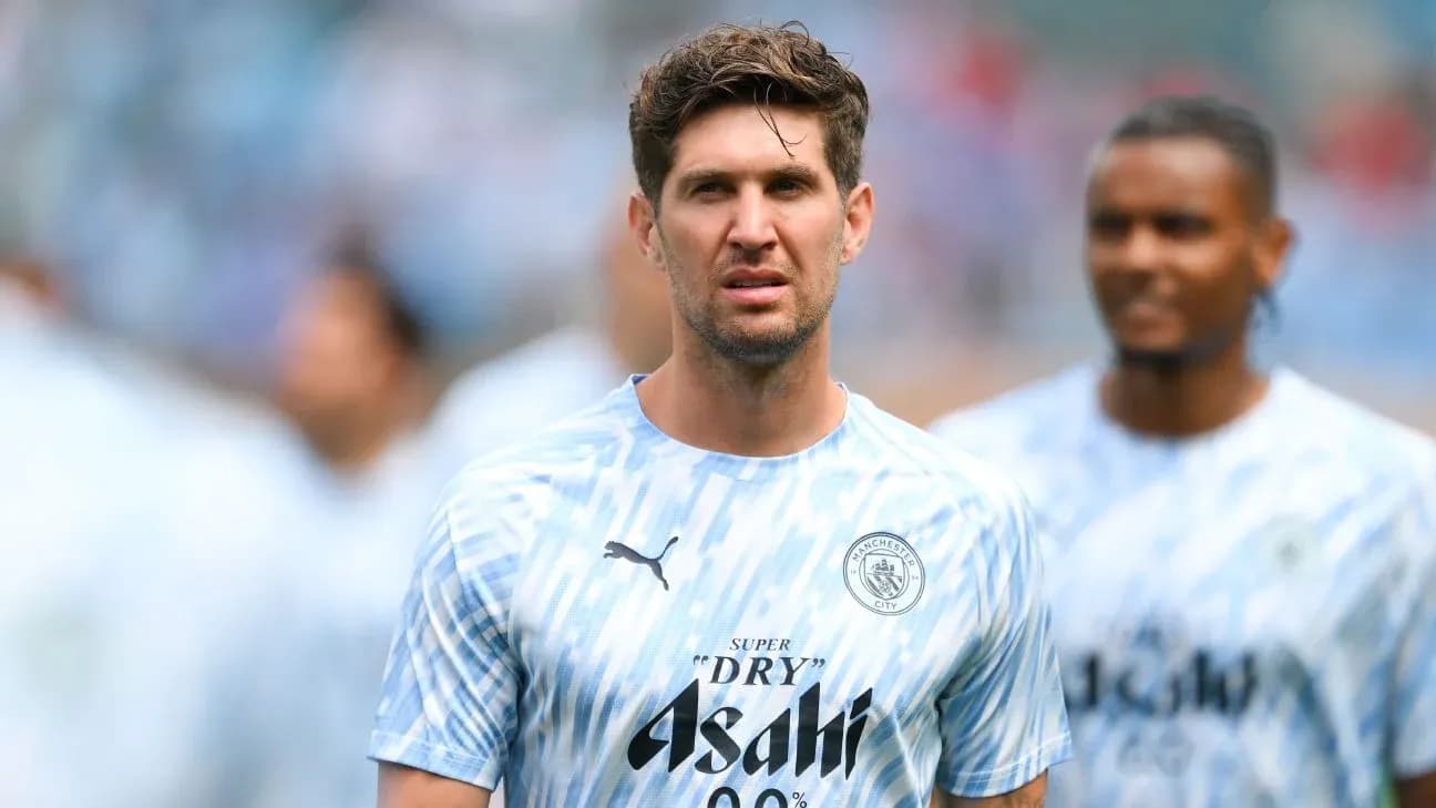 Player in Manchester City training kit on field Player in Manchester City training kit on field