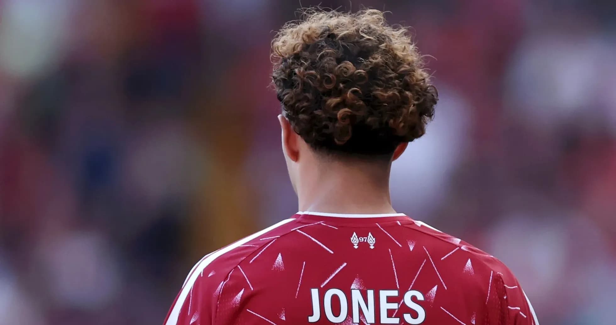 Player in red jersey with name 'JONES' visible Player in red jersey with name 'JONES' visible