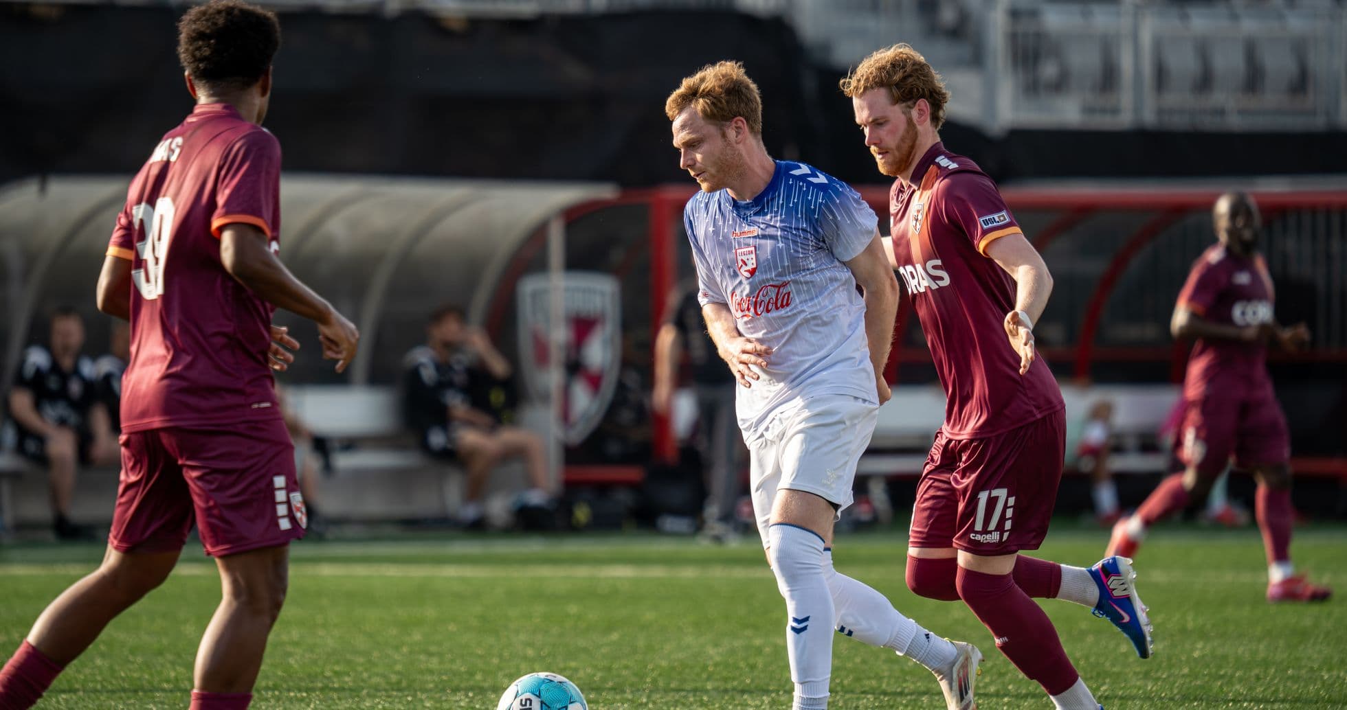 Players competing for the ball in USL match Players competing for the ball in USL match
