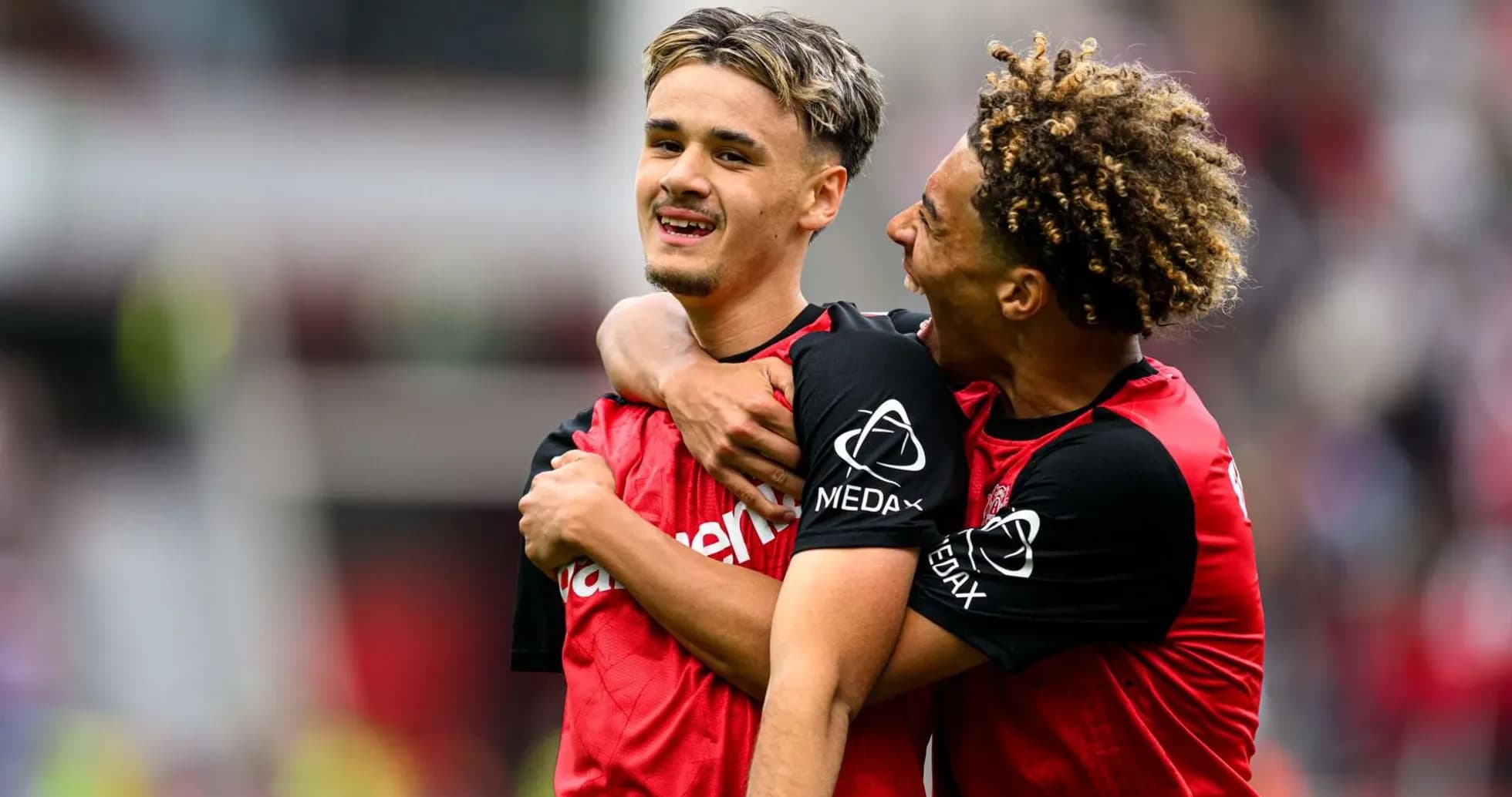 Bayer Leverkusen players celebrating a goal Bayer Leverkusen players celebrating a goal