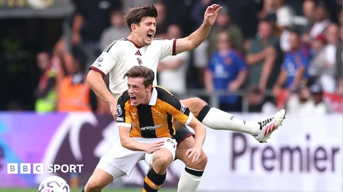 Player tackling opponent during a football match Player tackling opponent during a football match