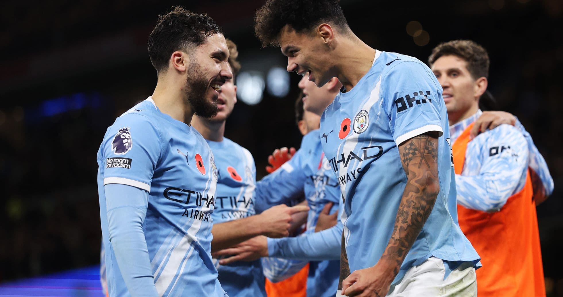 Manchester City players celebrating a goal Manchester City players celebrating a goal