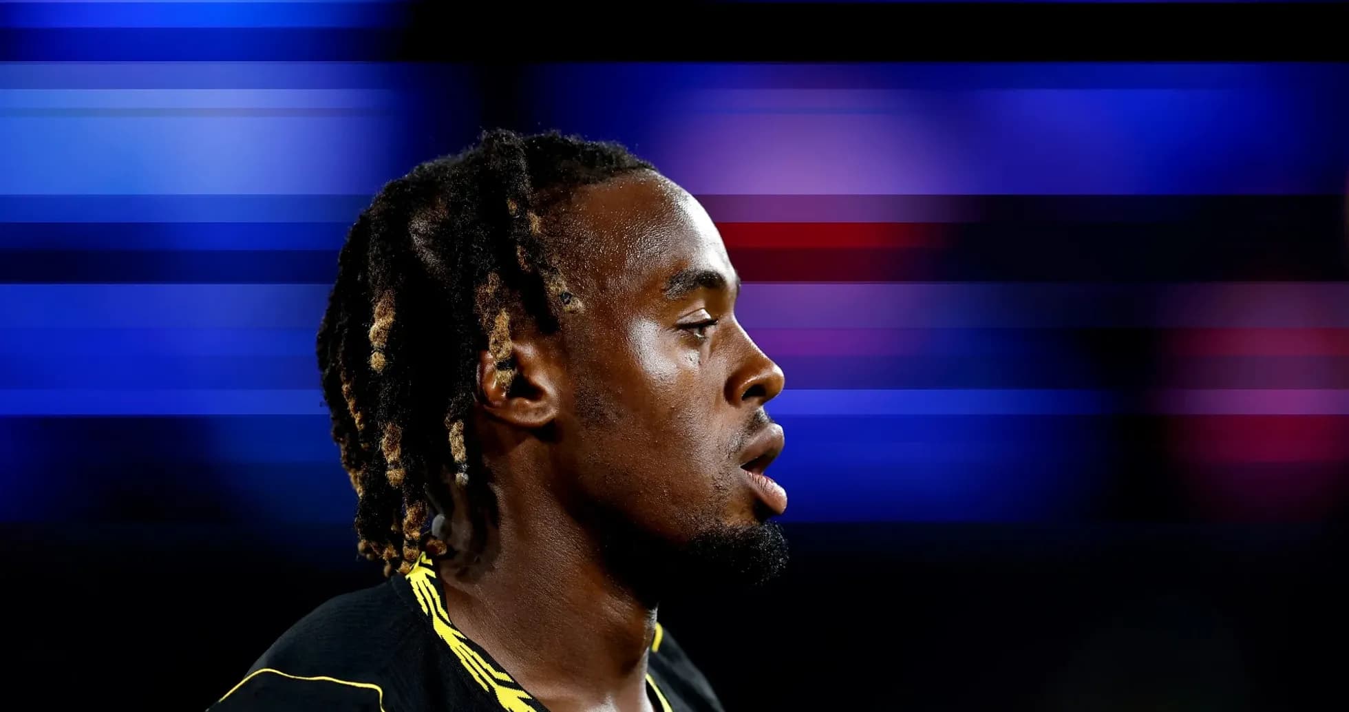 Athlete in profile with blurred colorful background Athlete in profile with blurred colorful background