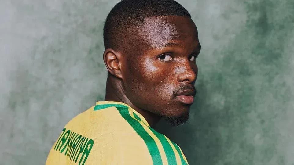 Player in yellow jersey looking over shoulder Player in yellow jersey looking over shoulder