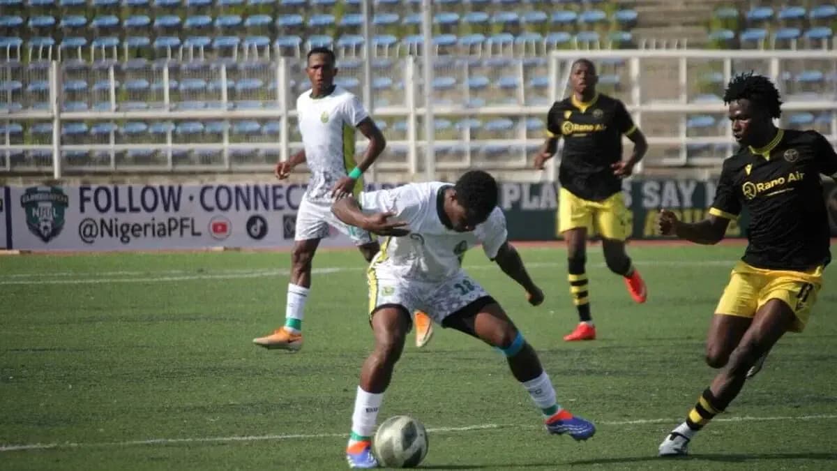 Player attempting to control the ball during match Player attempting to control the ball during match