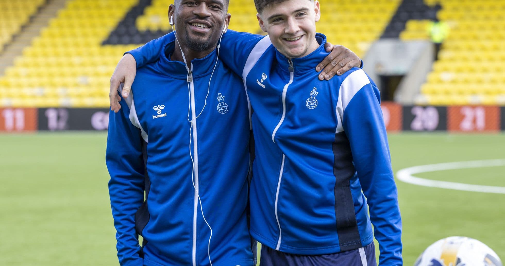 Two players posing together on the field Two players posing together on the field