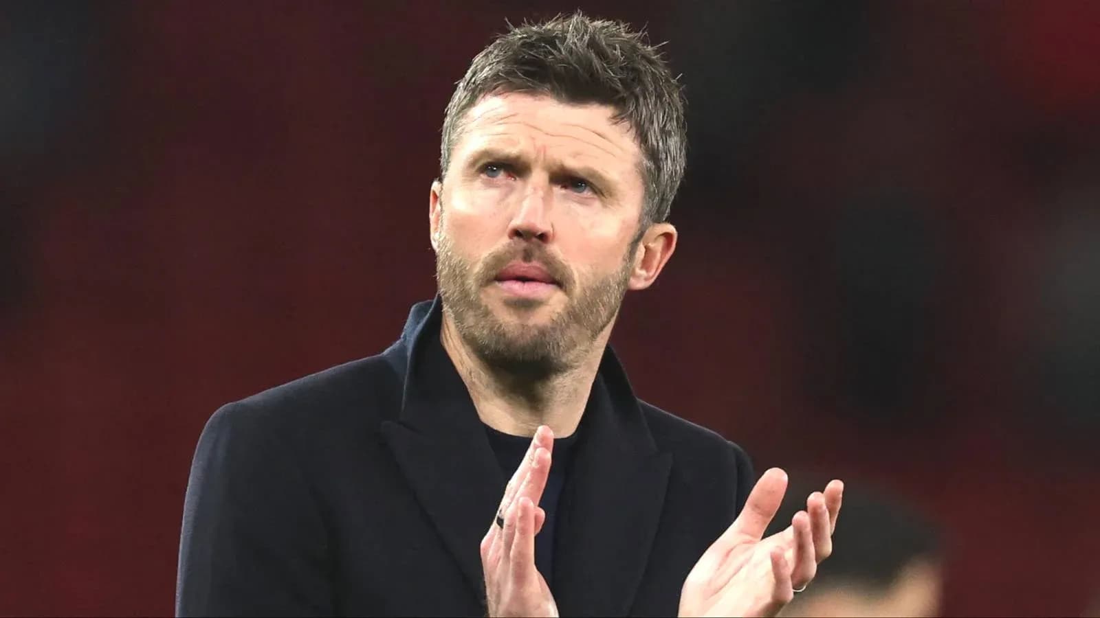 Manager applauding after a match Manager applauding after a match