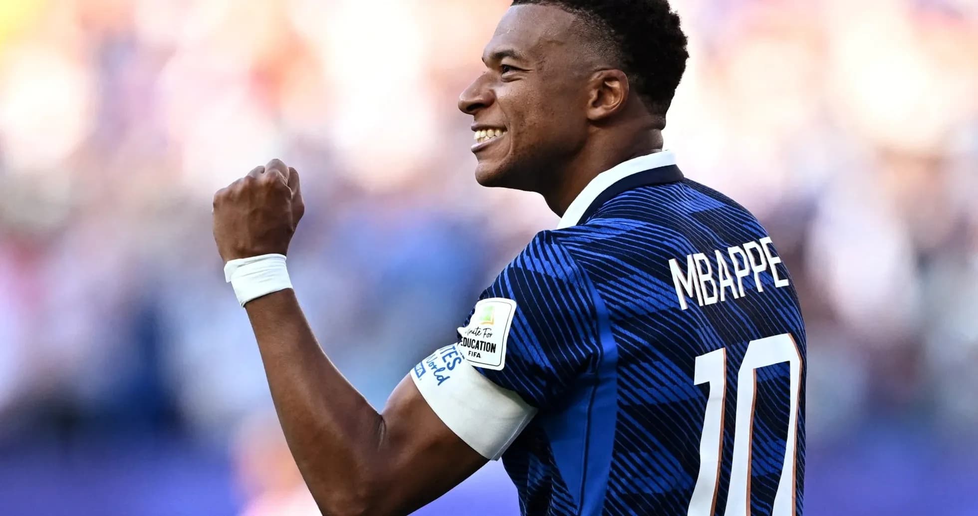 Kylian Mbappe celebrating during a football match Kylian Mbappe celebrating during a football match