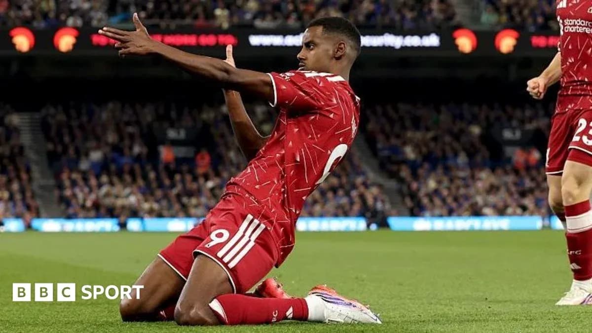 Player celebrating after scoring a goal for Liverpool Player celebrating after scoring a goal for Liverpool