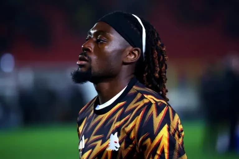 Player in colorful jersey walking on the pitch Player in colorful jersey walking on the pitch