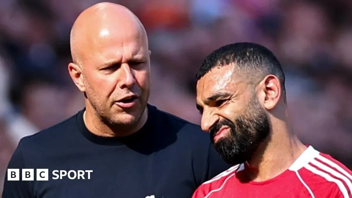 Two men talking on the sidelines of a match Two men talking on the sidelines of a match