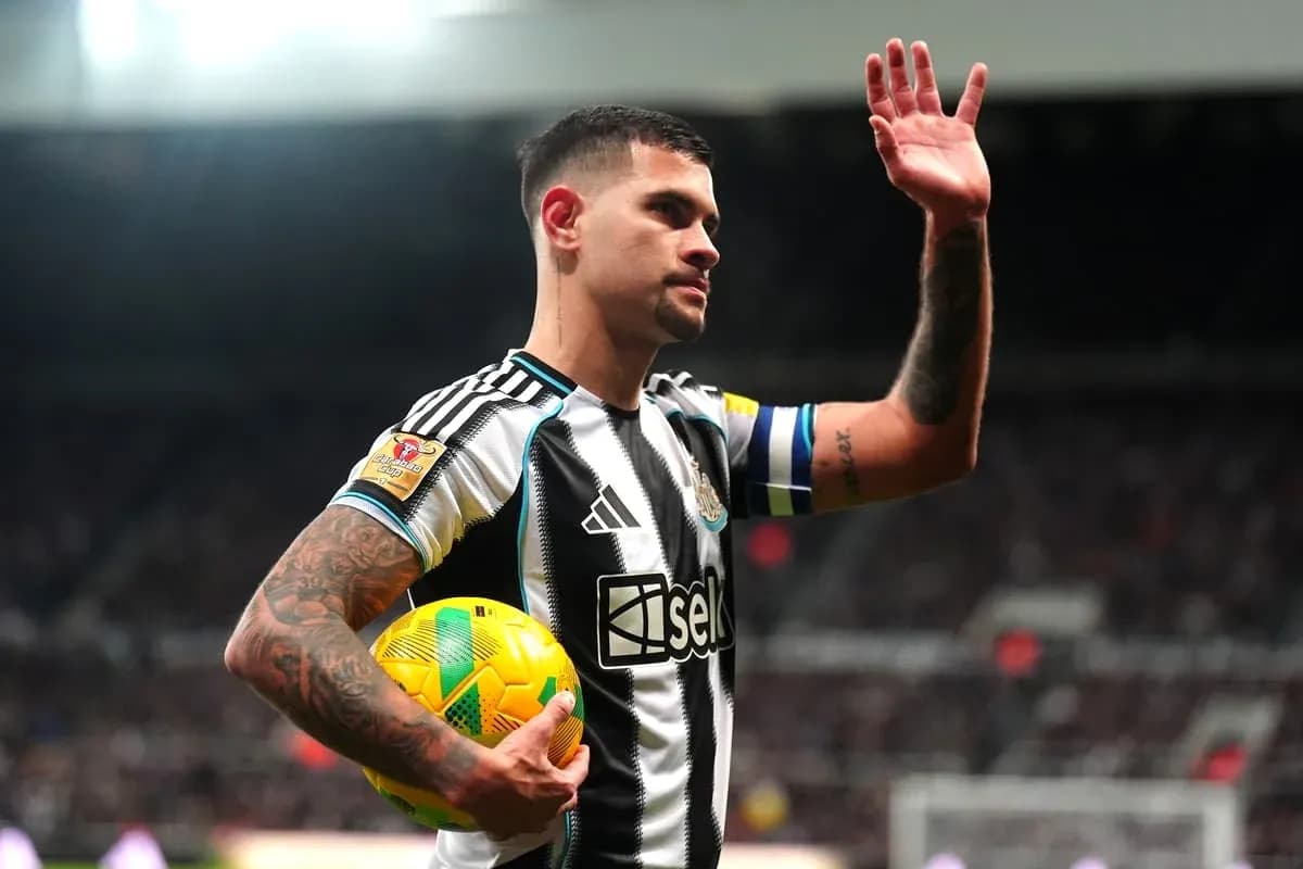 Player waving while holding a soccer ball Player waving while holding a soccer ball