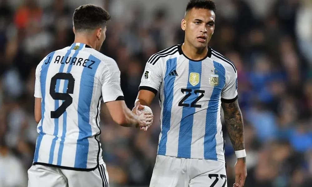 Two Argentine players shaking hands on the field Two Argentine players shaking hands on the field