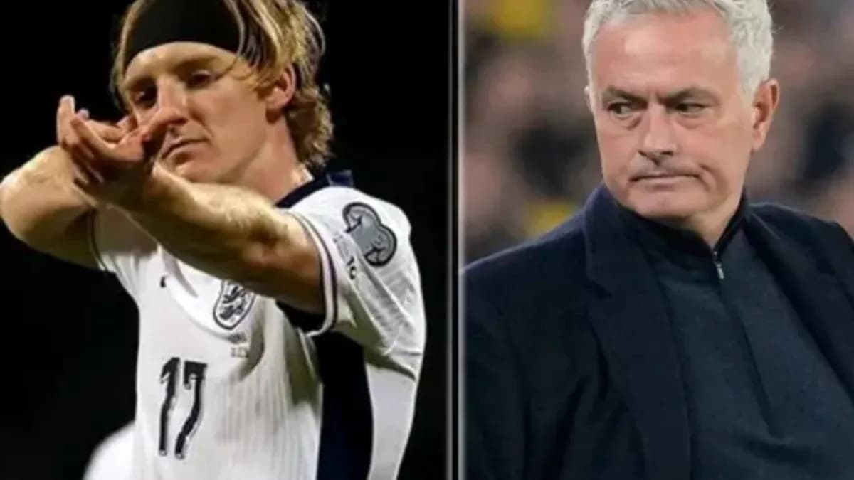 Football player celebrating and coach observing match Football player celebrating and coach observing match