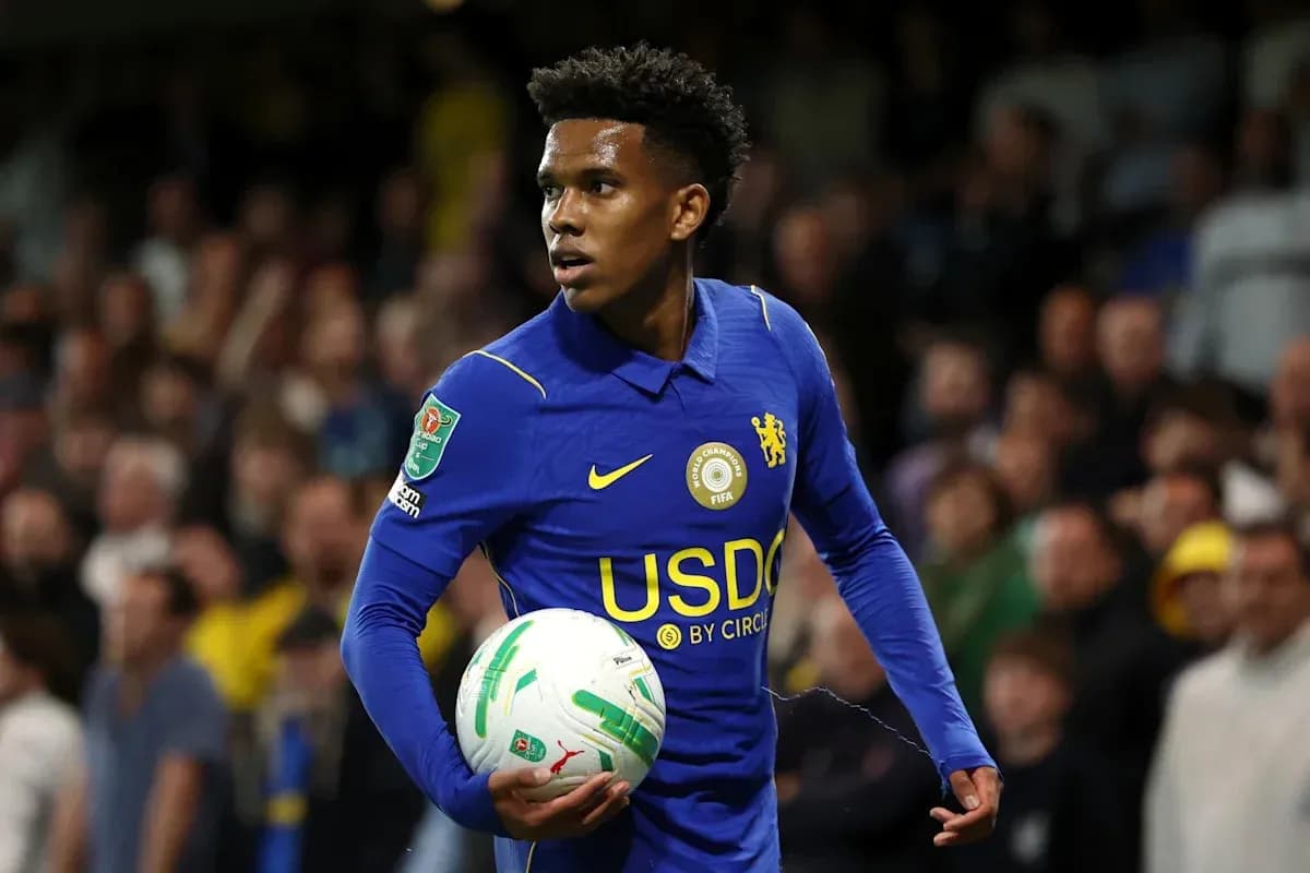 Player in blue jersey holding soccer ball during match Player in blue jersey holding soccer ball during match