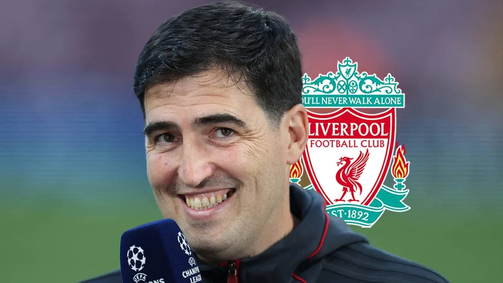 Person smiling during a Liverpool FC interview Person smiling during a Liverpool FC interview