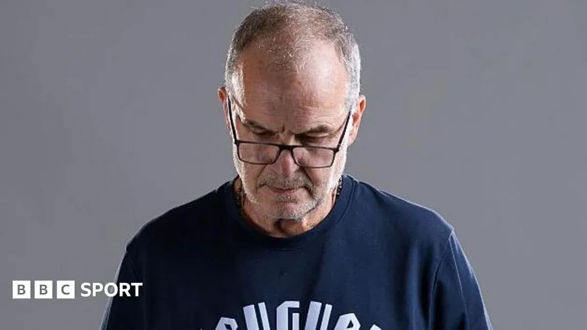 Man wearing glasses looking down with gray background Man wearing glasses looking down with gray background