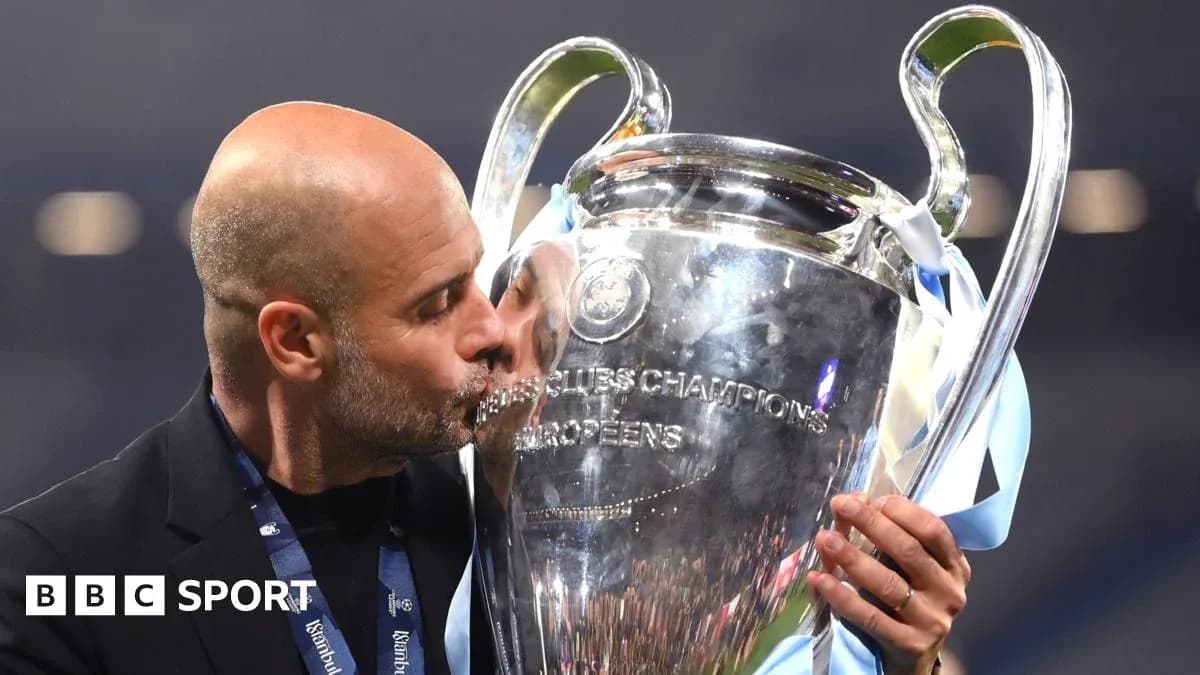 Manager kissing UEFA Champions League trophy Manager kissing UEFA Champions League trophy