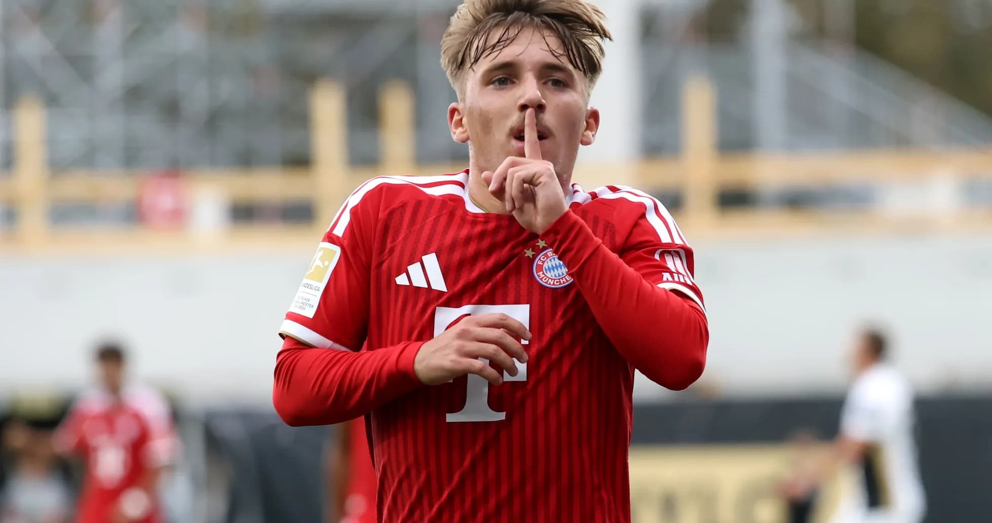 Player celebrating with a shushing gesture after scoring Player celebrating with a shushing gesture after scoring