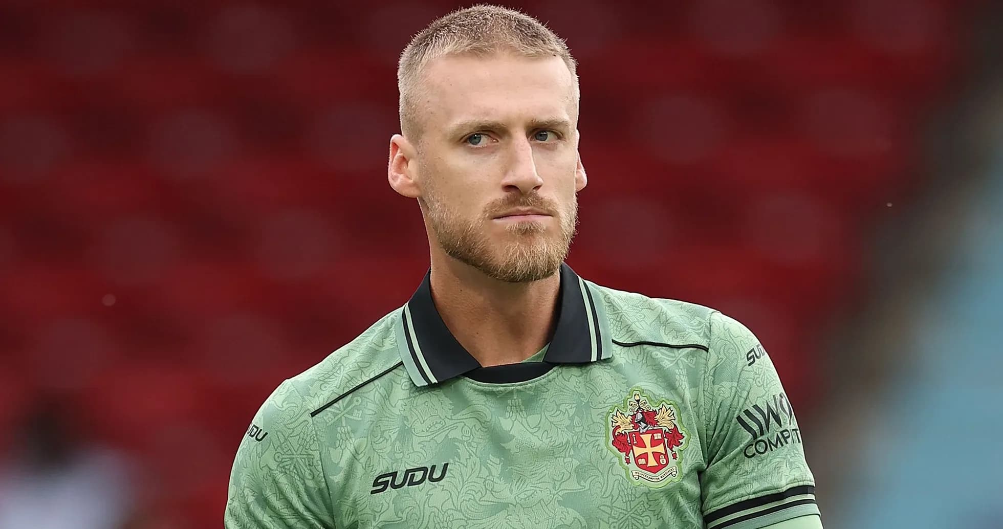 Goalkeeper wearing green kit before match Goalkeeper wearing green kit before match