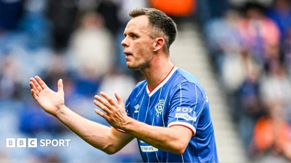 Player gesturing during a football match Player gesturing during a football match