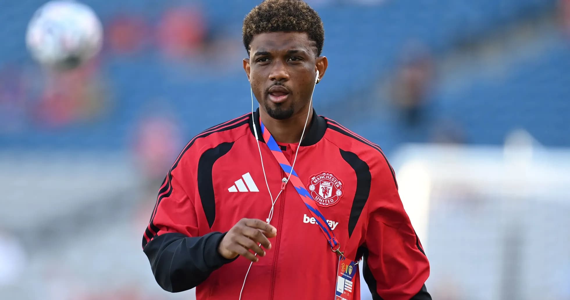 Player in Manchester United training gear walking Player in Manchester United training gear walking