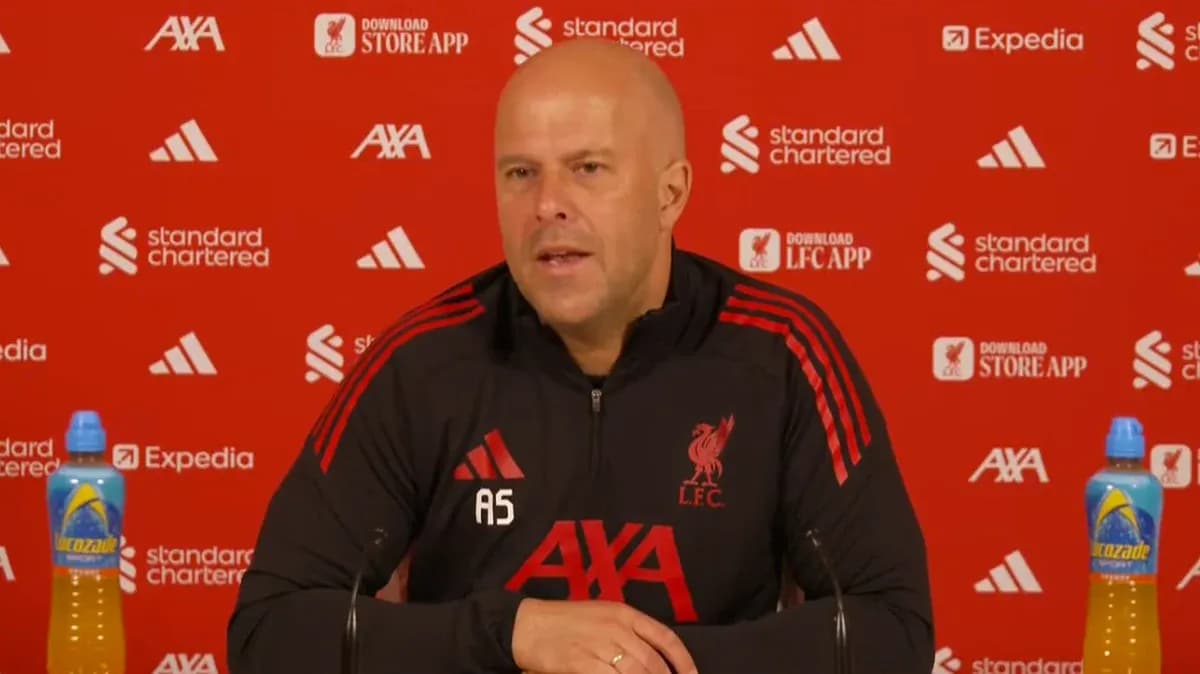 Liverpool manager speaking at press conference podium Liverpool manager speaking at press conference podium