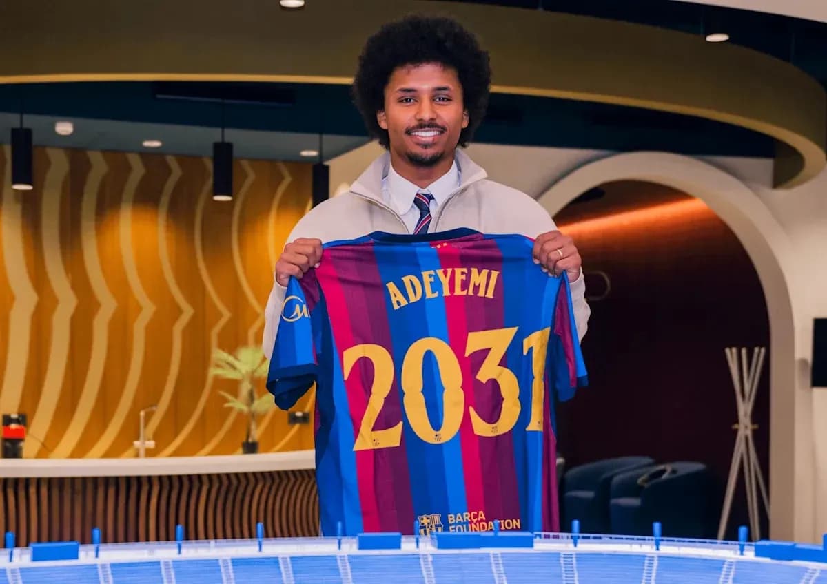 Player holding Barcelona jersey with name and number Player holding Barcelona jersey with name and number