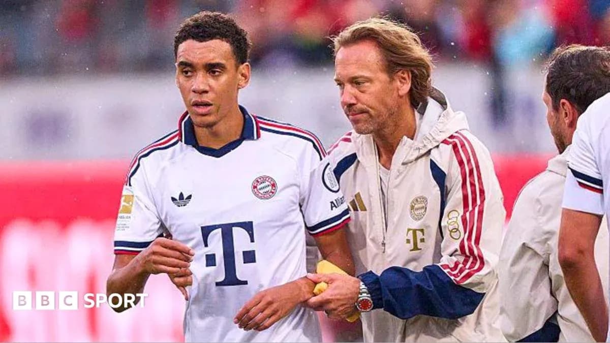 Player being assisted by staff during match Player being assisted by staff during match
